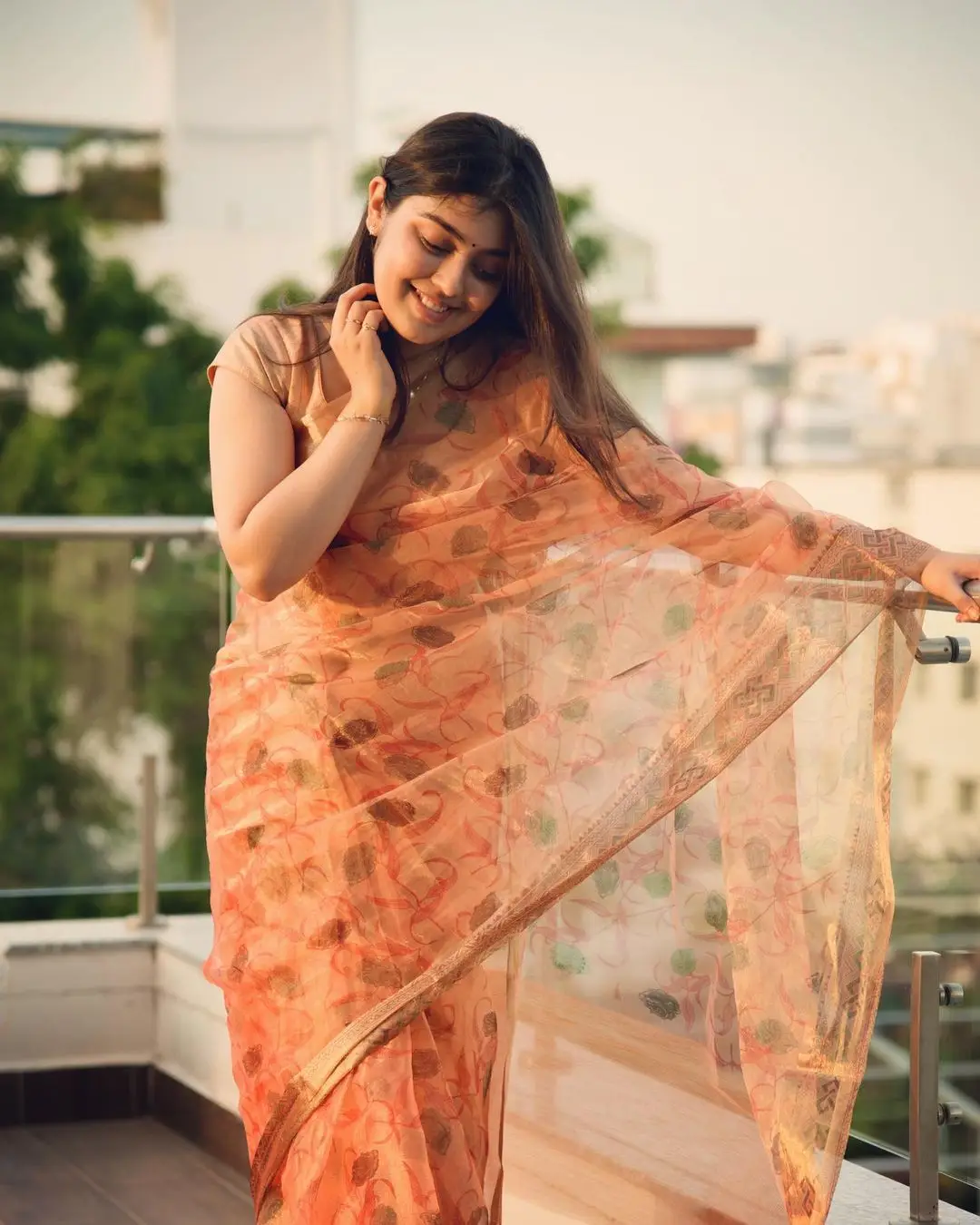 Gargeyi Yellapragada Smiling Face Long Hair Orange Saree